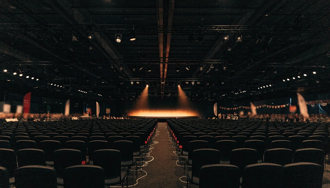 A convention hall stage awaiting the night's program, viewed from the delegate floor